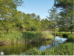 Abb. 5: Abschnitt Hoppenrade im Mai 2018 (zwölf Jahre nach der Umsetzung). Geschwungener Flusslauf einschließlich beidseitiger Wasserwechselzone, gesäumt von einem sich naturnah entwickelnden, bis zu 120 m breiten Niederungswald.